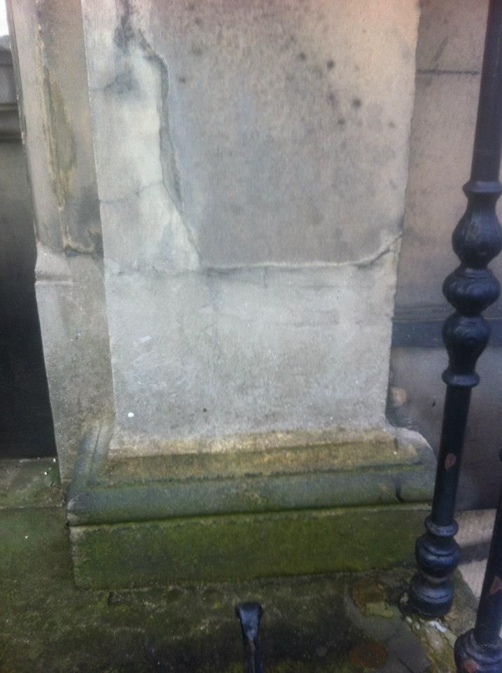 Weathered stone column base restoration Edinburgh stone masons.