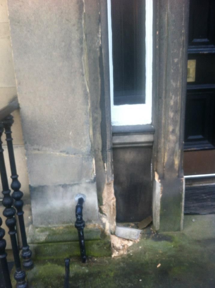 Cracked stone façade repair by Edinburgh stonemasons, specialising in heritage restoring and weathered stonework.