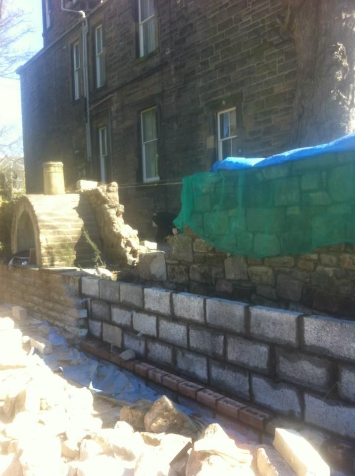 Historic stone wall restoration by IMC Stonemasons Limited in Edinburgh.
