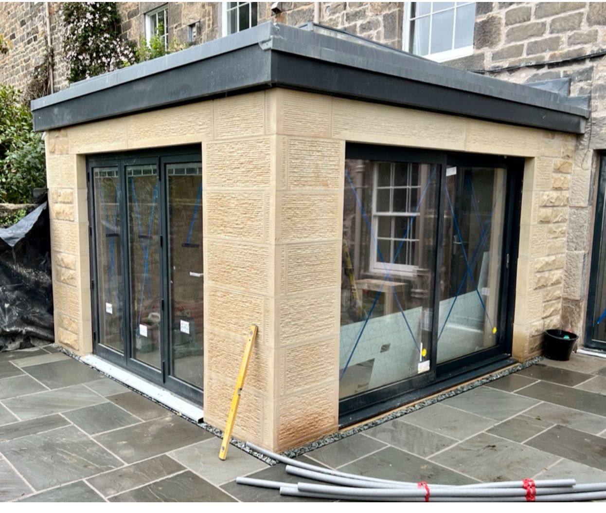 Precision stonework for modern exterior extension by IMC Stonemasons Limited, Edinburgh's expert stone masons.