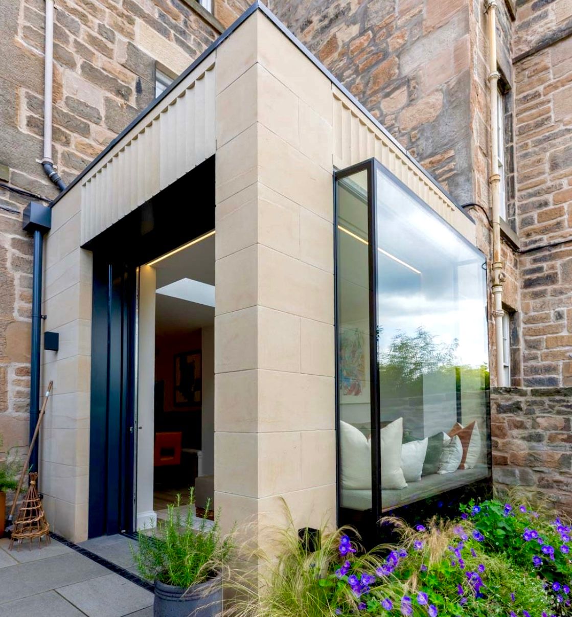 Modern stone cladding and glass extension by IMC Stonemasons Limited in Edinburgh.